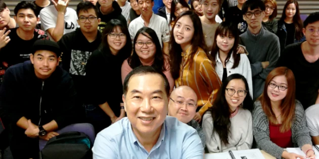 Timotheus with students at a lecture